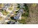 Aerial image showing neighborhood with mature trees and the house with solar panels at 10129 Loch Lomond Dr, Charlotte, NC 28278