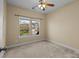 Neutral bedroom with natural light from double windows at 10129 Loch Lomond Dr, Charlotte, NC 28278