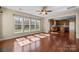 Inviting living room with hardwood floors, lots of light, and an open floor plan to the kitchen at 10129 Loch Lomond Dr, Charlotte, NC 28278