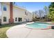 Backyard oasis featuring an in-ground pool, patio with seating, a hammock, and mature trees at 105 Easy St, Mooresville, NC 28117