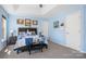A blue bedroom featuring trey ceilings, three pieces of decorative art, and multiple doors at 105 Easy St, Mooresville, NC 28117