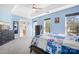 A light blue bedroom with trey ceilings, a ceiling fan, and large windows providing natural light at 105 Easy St, Mooresville, NC 28117