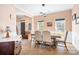 Elegant dining room with modern lighting, a dining table with chairs, and hardwood floors at 105 Easy St, Mooresville, NC 28117