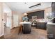 Kitchen featuring a kitchen island, stainless steel appliances, modern cabinets, and wood laminate flooring at 105 Easy St, Mooresville, NC 28117