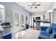 Charming kitchenette with white cabinets, stainless steel appliances, and French doors to the yard at 105 Easy St, Mooresville, NC 28117