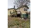 Backyard view featuring a small deck, wooden staircase, and chimney at 1140 Mt Vernon Rd, Woodleaf, NC 27054