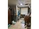 The bathroom is compact with tiled floors, a shower with a patterned curtain, and a window with blinds at 1140 Mt Vernon Rd, Woodleaf, NC 27054
