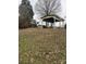 Outdoor area features an open-air carport structure with satellite dish at 1140 Mt Vernon Rd, Woodleaf, NC 27054