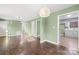 Spacious living room with hardwood floors and ample natural light, connecting to the kitchen at 1203 Northwoods Dr, Kings Mountain, NC 28086