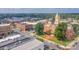 Overhead perspective of the town showcasing the historic courthouse and bustling streets surrounded by verdant trees at 1240 Cottage Green Dr # 0132, Monroe, NC 28112