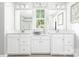 Bright bathroom with double vanity, large mirrors, and modern fixtures at 1240 Cottage Green Dr # 0132, Monroe, NC 28112