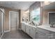 Clean, bright bathroom with double vanity, ample counter space, and a glass-enclosed shower at 1240 Cottage Green Dr # 0132, Monroe, NC 28112