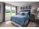 Inviting bedroom with a cozy bed, calming color scheme, and natural light at 1240 Cottage Green Dr # 0132, Monroe, NC 28112