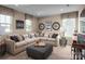 Comfortable bonus room featuring a large sectional sofa and playful decor at 1240 Cottage Green Dr # 0132, Monroe, NC 28112