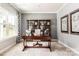 Cozy home office featuring a wooden desk, bookcase, and soft neutral carpet at 1240 Cottage Green Dr # 0132, Monroe, NC 28112