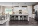 Bright, open kitchen featuring a large island with seating and modern stainless steel appliances at 1240 Cottage Green Dr # 0132, Monroe, NC 28112