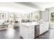 Open kitchen with large island, stainless steel dishwasher, and an adjacent living and dining area at 1240 Cottage Green Dr # 0132, Monroe, NC 28112