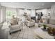 Open-concept living area with kitchen, dining and seating, showcasing modern design at 1240 Cottage Green Dr # 0132, Monroe, NC 28112