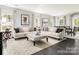 Comfortable living room with stylish furniture, hardwood floors, and plenty of natural light at 1240 Cottage Green Dr # 0132, Monroe, NC 28112