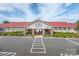 Entrance to the community water park and fitness center, with ample parking and colorful landscaping at 1240 Cottage Green Dr # 0132, Monroe, NC 28112