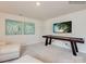 Spacious game room with large wall-mounted TV, perfect for entertaining at 13112 Hampton Bay Ln, Charlotte, NC 28262