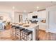 Open-concept kitchen with an island, bar stool seating, and modern appliances at 13112 Hampton Bay Ln, Charlotte, NC 28262