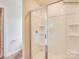 Modern shower with clear glass enclosure and built-in shelves for toiletries at 13112 Hampton Bay Ln, Charlotte, NC 28262