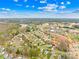 Expansive aerial view of a suburban neighborhood showcasing homes, roads, and community amenities nearby at 134 Citation Dr, Mooresville, NC 28117