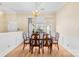 Well-lit dining area with hardwood floors, a classic chandelier, and views of the front yard at 134 Citation Dr, Mooresville, NC 28117