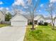 Charming single-story home with a two-car garage, well-manicured lawn, and inviting curb appeal at 134 Citation Dr, Mooresville, NC 28117