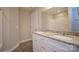 Bathroom featuring double sinks, granite countertops, white cabinets, and a shower/tub combo at 1479 Southwest Blvd, Newton, NC 28658