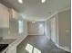 Bright dining room with hardwood floors, modern lighting, and neutral walls at 1479 Southwest Blvd, Newton, NC 28658
