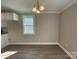 Dining room with hardwood floors and neutral colored walls, and modern lighting at 1479 Southwest Blvd, Newton, NC 28658