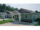 Charming single Gathering home with a green exterior, stone accents, and a well-manicured lawn at 1479 Southwest Blvd, Newton, NC 28658