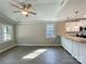 The living room features plank flooring, white trim, and granite countertop in the kitchen at 1479 Southwest Blvd, Newton, NC 28658