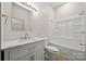 Bright bathroom featuring vanity, toilet, and shower over bath at 167 Saluda St, Chester, SC 29706