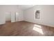Bright bedroom featuring a walk-in closet and hardwood floors at 167 Saluda St, Chester, SC 29706
