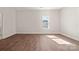 Bedroom with hardwood floors, large window and light coloured walls at 167 Saluda St, Chester, SC 29706