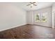 Well-lit bedroom with hardwood floors, and a large window for ample natural light at 167 Saluda St, Chester, SC 29706