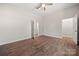 Bright bedroom with hardwood floors, ceiling fan, and walk-in closet at 167 Saluda St, Chester, SC 29706