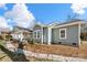 A view of the home's side exterior and yard with mulched flower beds at 167 Saluda St, Chester, SC 29706