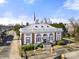 Aerial view of the Chester Post Office, a historic building, with red brick exterior, white trim and a white roof at 167 Saluda St, Chester, SC 29706