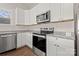 Bright kitchen with stainless steel appliances, granite countertops and white cabinetry at 167 Saluda St, Chester, SC 29706