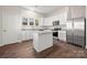 Modern kitchen featuring stainless steel appliances, an island, and ample cabinet space at 167 Saluda St, Chester, SC 29706