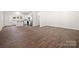 Open-concept living space with hardwood floors, connecting kitchen and living area at 167 Saluda St, Chester, SC 29706