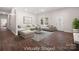 Bright living room features hardwood floors, a ceiling fan, and lots of natural light at 167 Saluda St, Chester, SC 29706