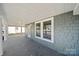 Covered porch with concrete floor and painted wood columns, offering outdoor space at 167 Saluda St, Chester, SC 29706