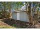 View of a backyard shed with a door, surrounded by trees at 167 Saluda St, Chester, SC 29706