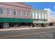 This is a street view of two brick buildings that include street-level retail space with awnings for shade at 167 Saluda St, Chester, SC 29706