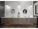 Stylish bathroom featuring a double sink vanity with modern fixtures and attractive lighting at 18601 Bluff Point Rd, Cornelius, NC 28031